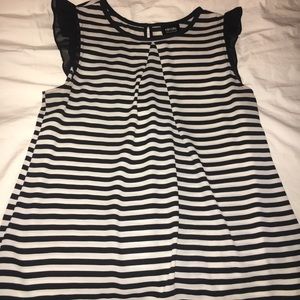 Nicole Miller black and white sleeveless blouse.